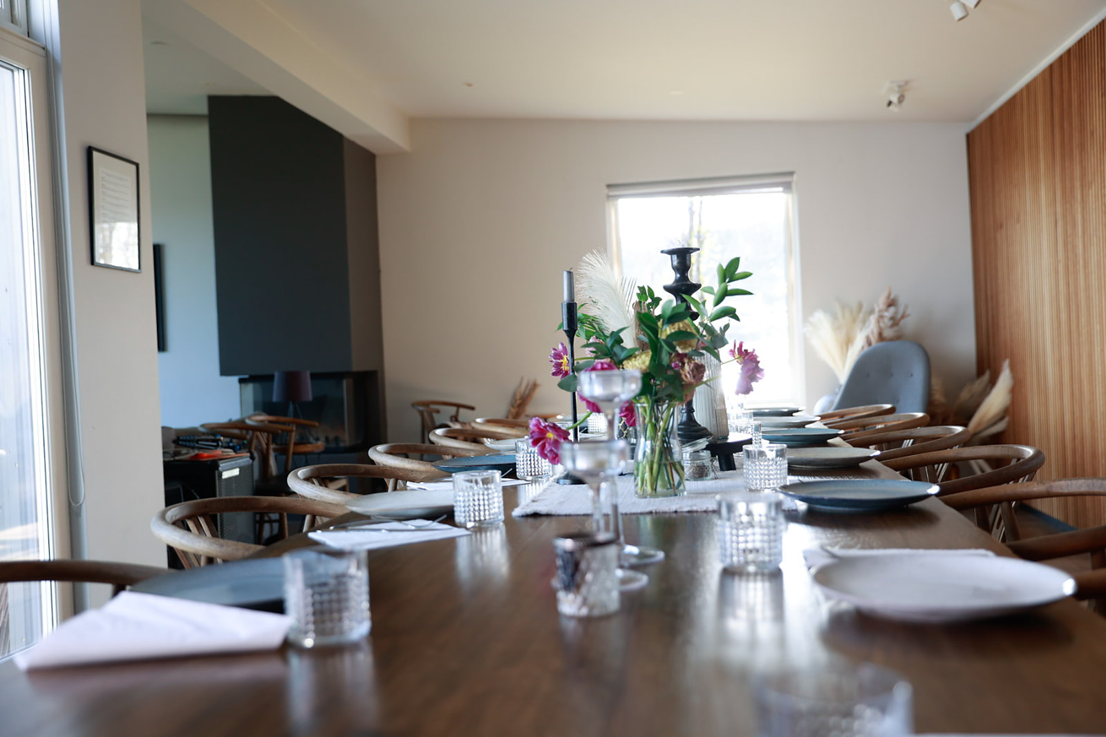 The lamplit dining table set for a meal