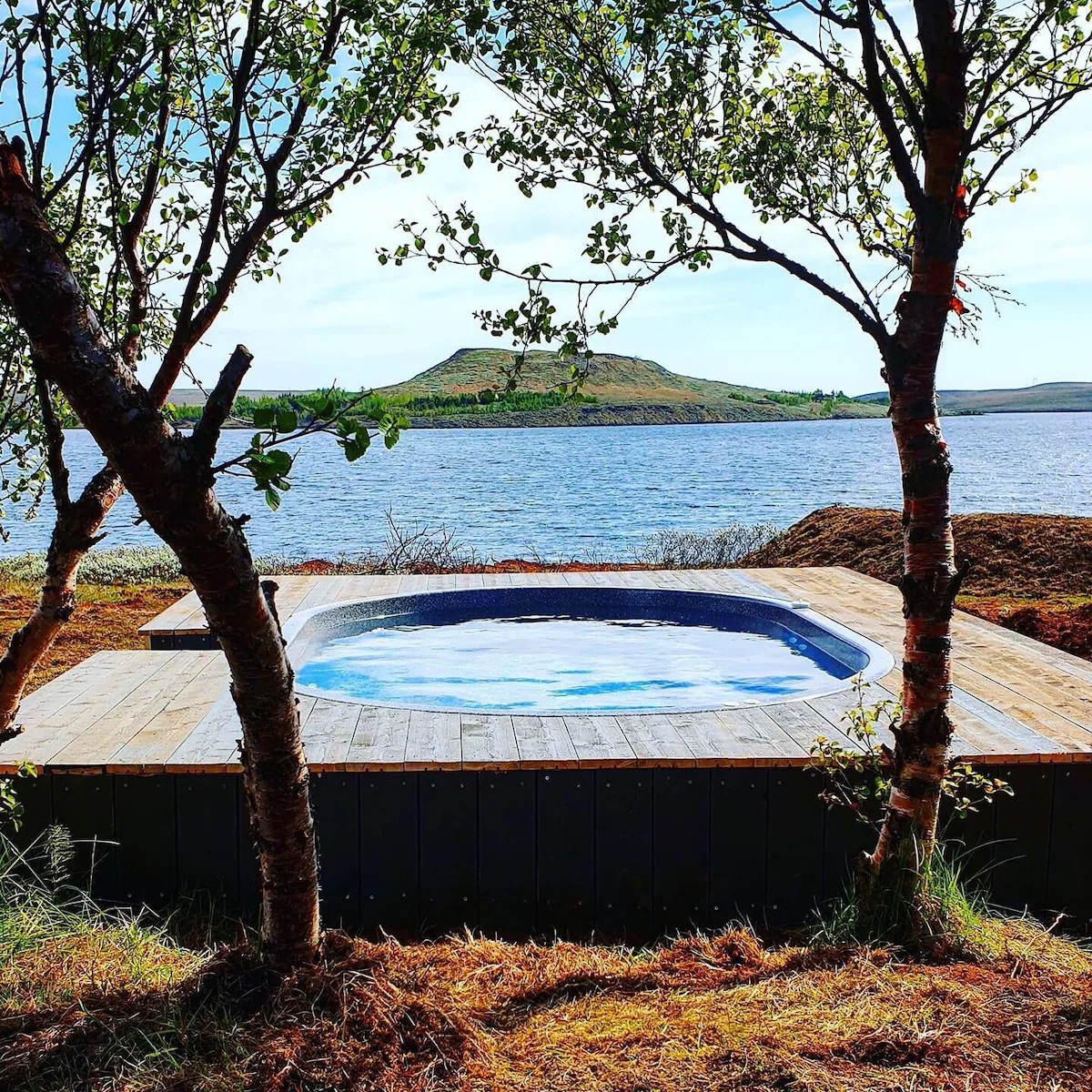The geothermal hot tub over the lake