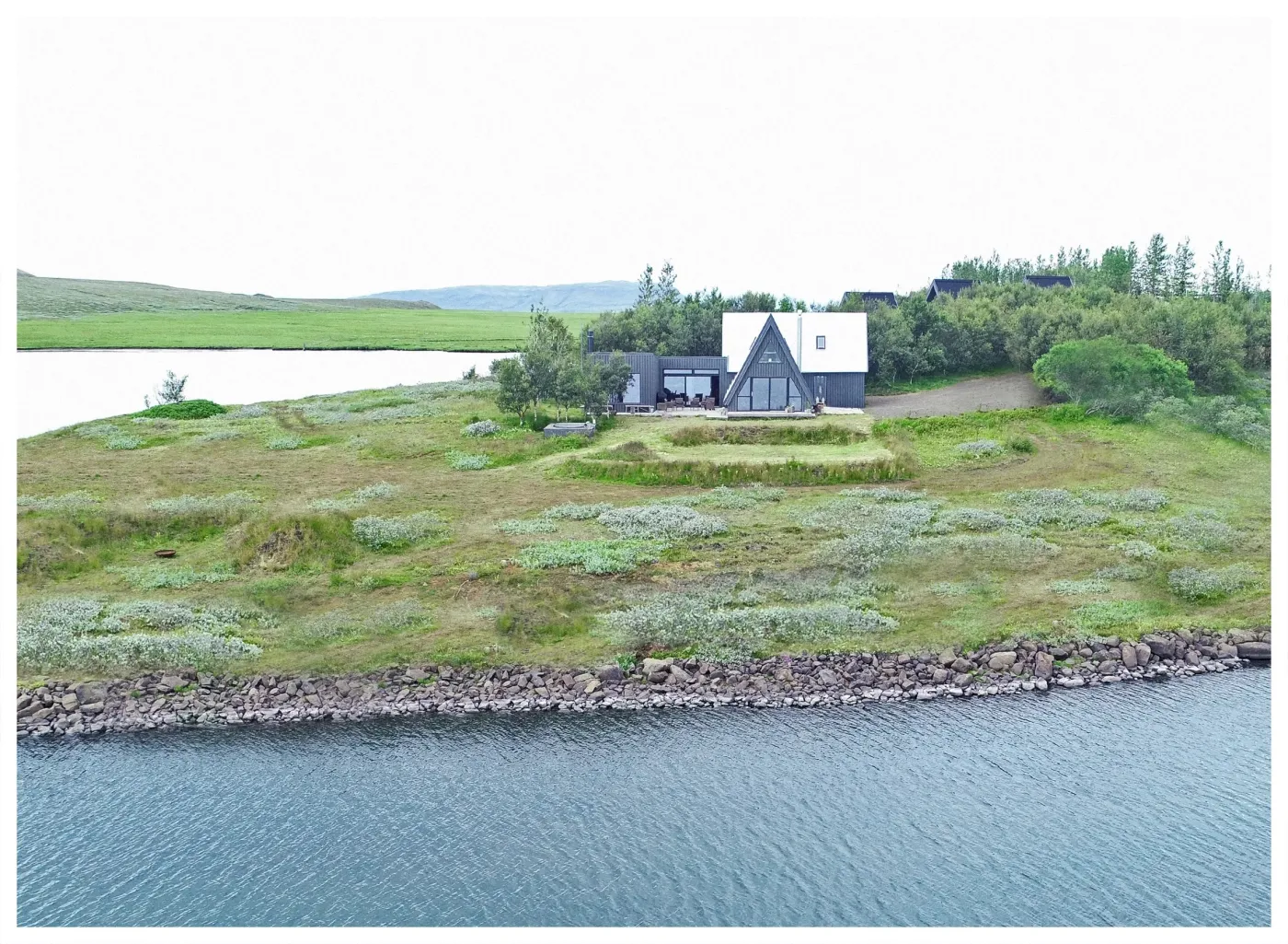 Aerial view of the home on its peninsula