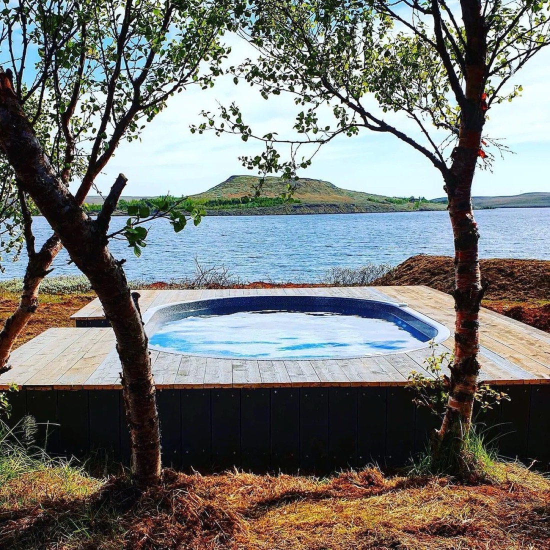The geothermal hot tub on the deck, looking over the lake
