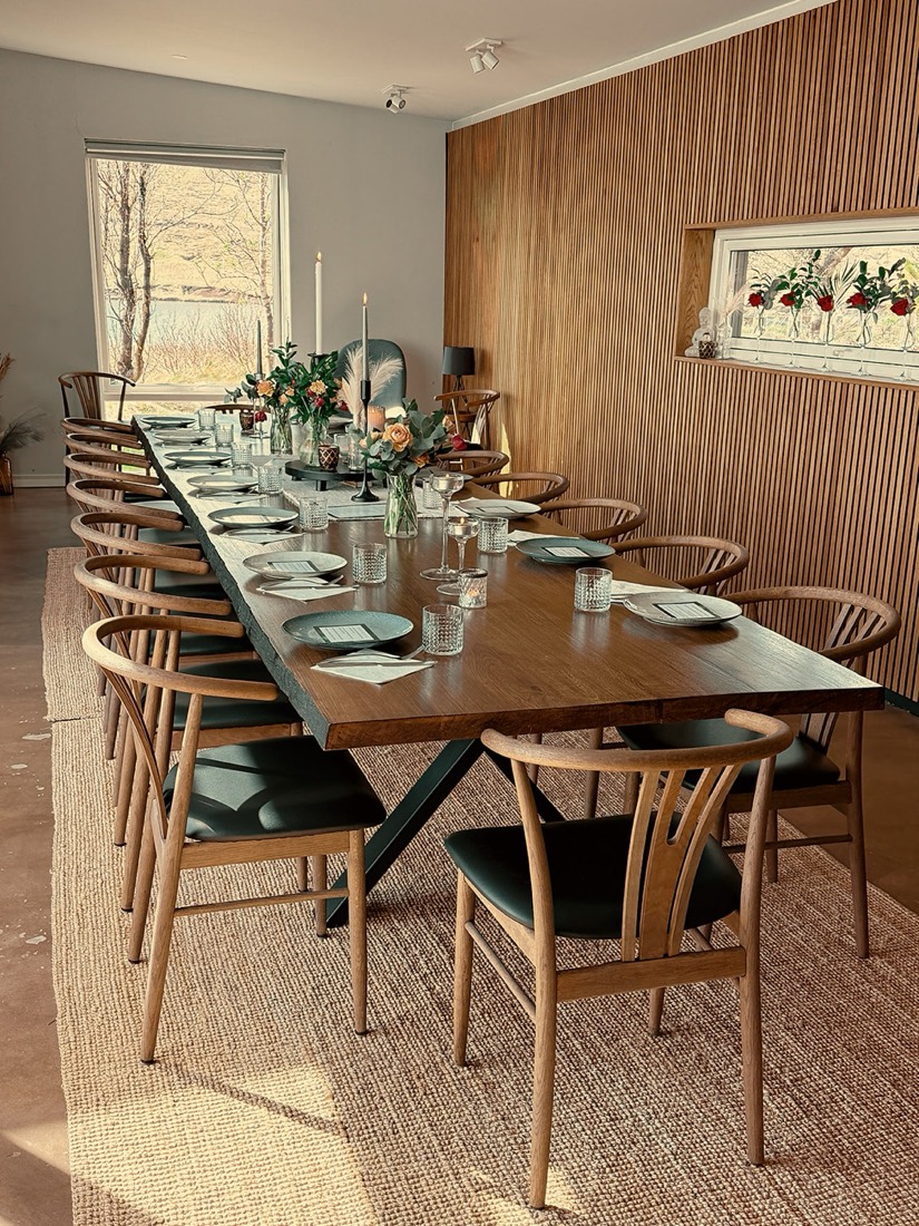 The communal dining hall, table set for the group